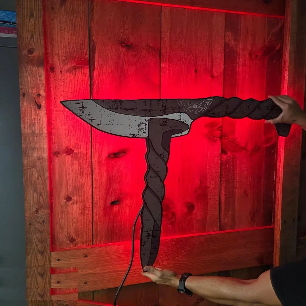 Custom interior LED-backlit wall sign with red halo lighting