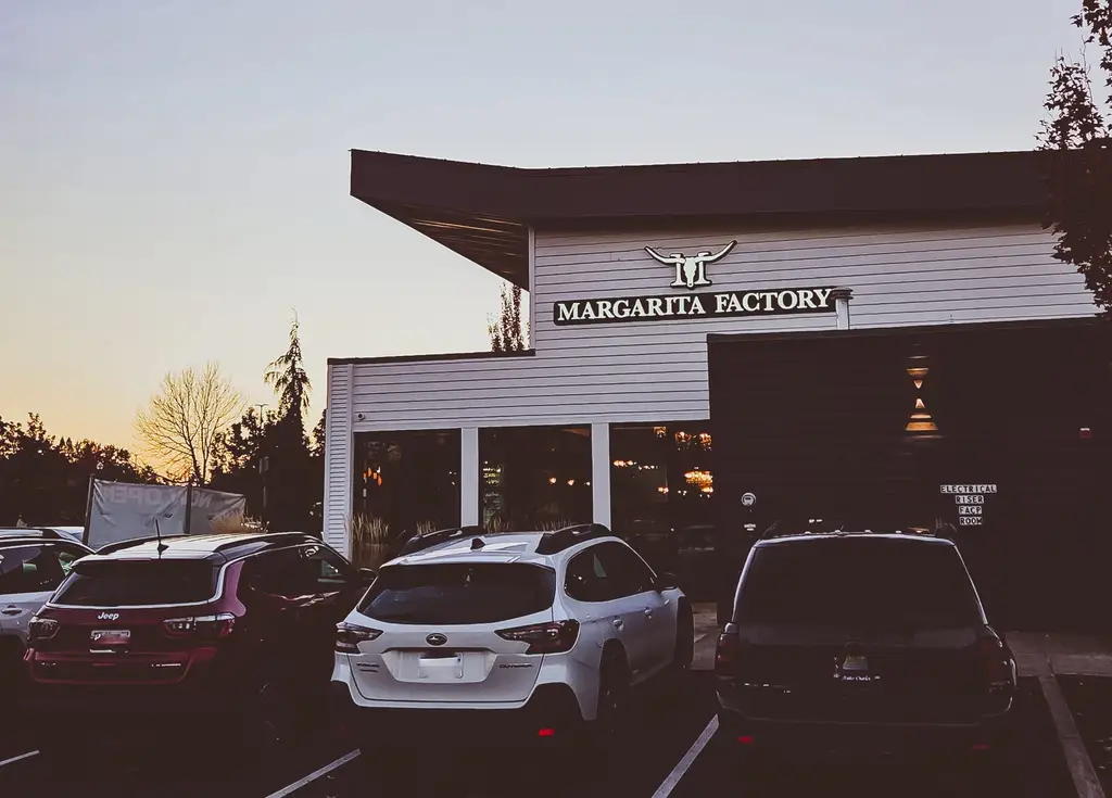 Margarita Factory illuminated sign at dusk